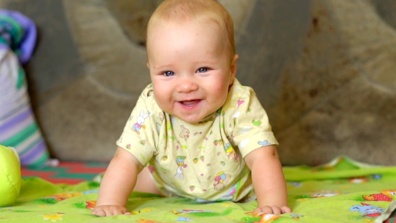 Smiling baby during 12 month speech and language development stage
