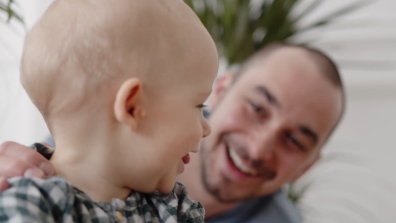 Father interacts with baby during early speech and language development
